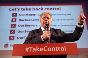 Boris Johnson in front of a Take Back Control poster